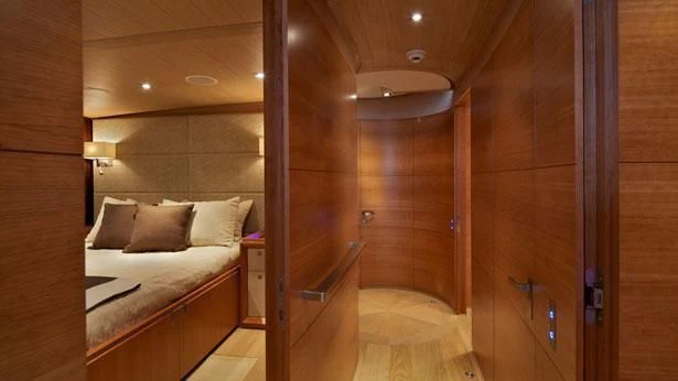 a room with a bed and a shower aboard SHARLOU Yacht for Sale