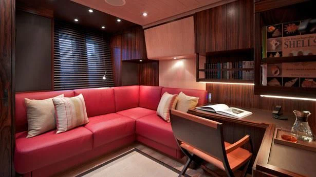 a room with a couch and a table aboard SHARLOU Yacht for Sale