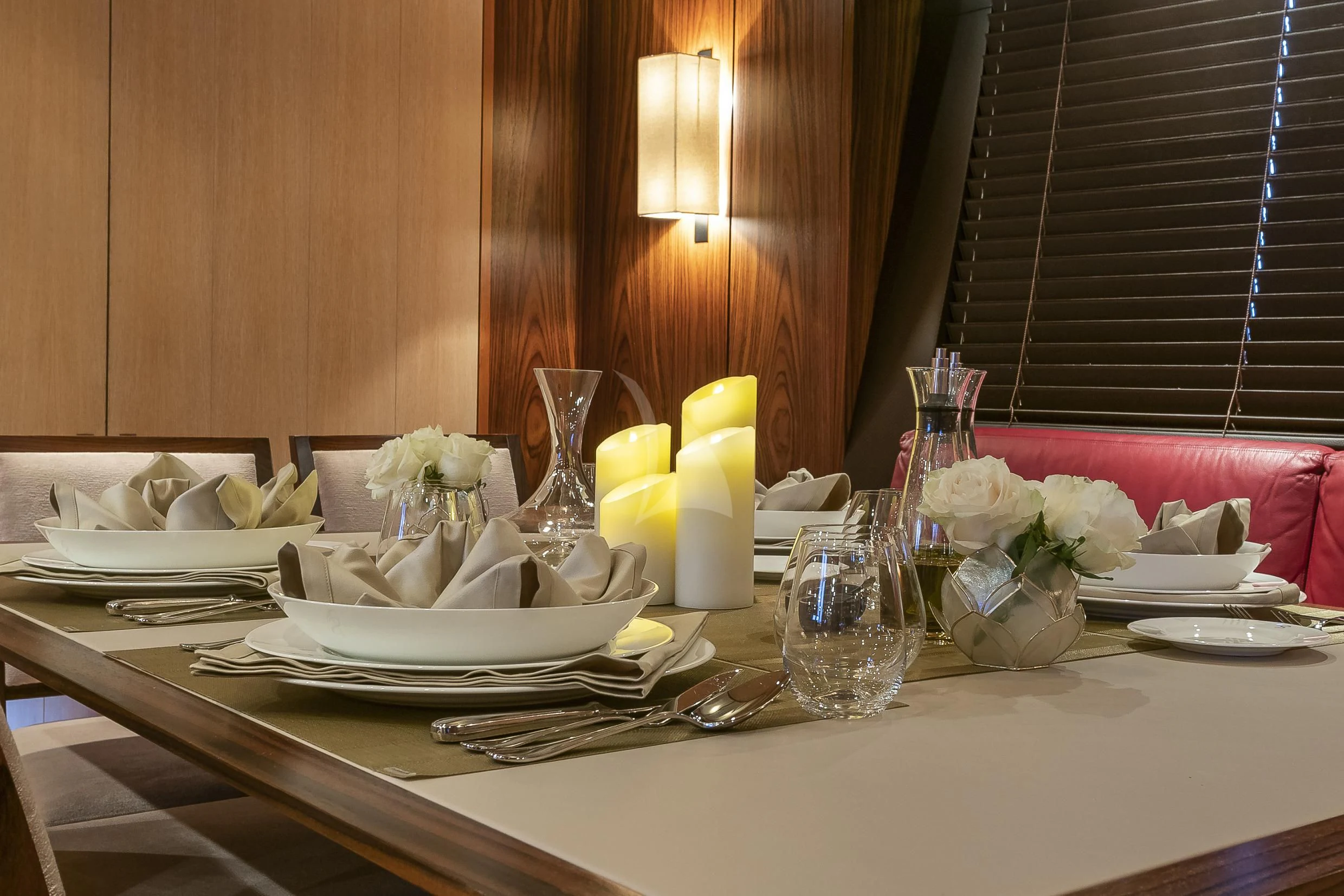 a table with plates and glasses aboard SHARLOU Yacht for Sale