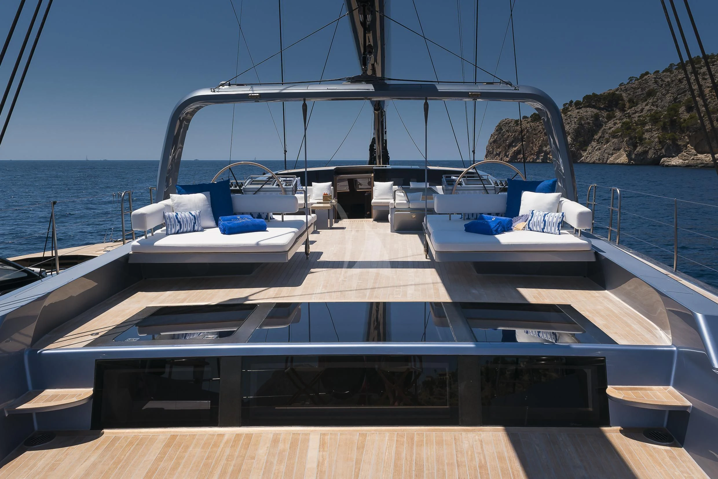 a deck with a large boat on it aboard SHARLOU Yacht for Sale