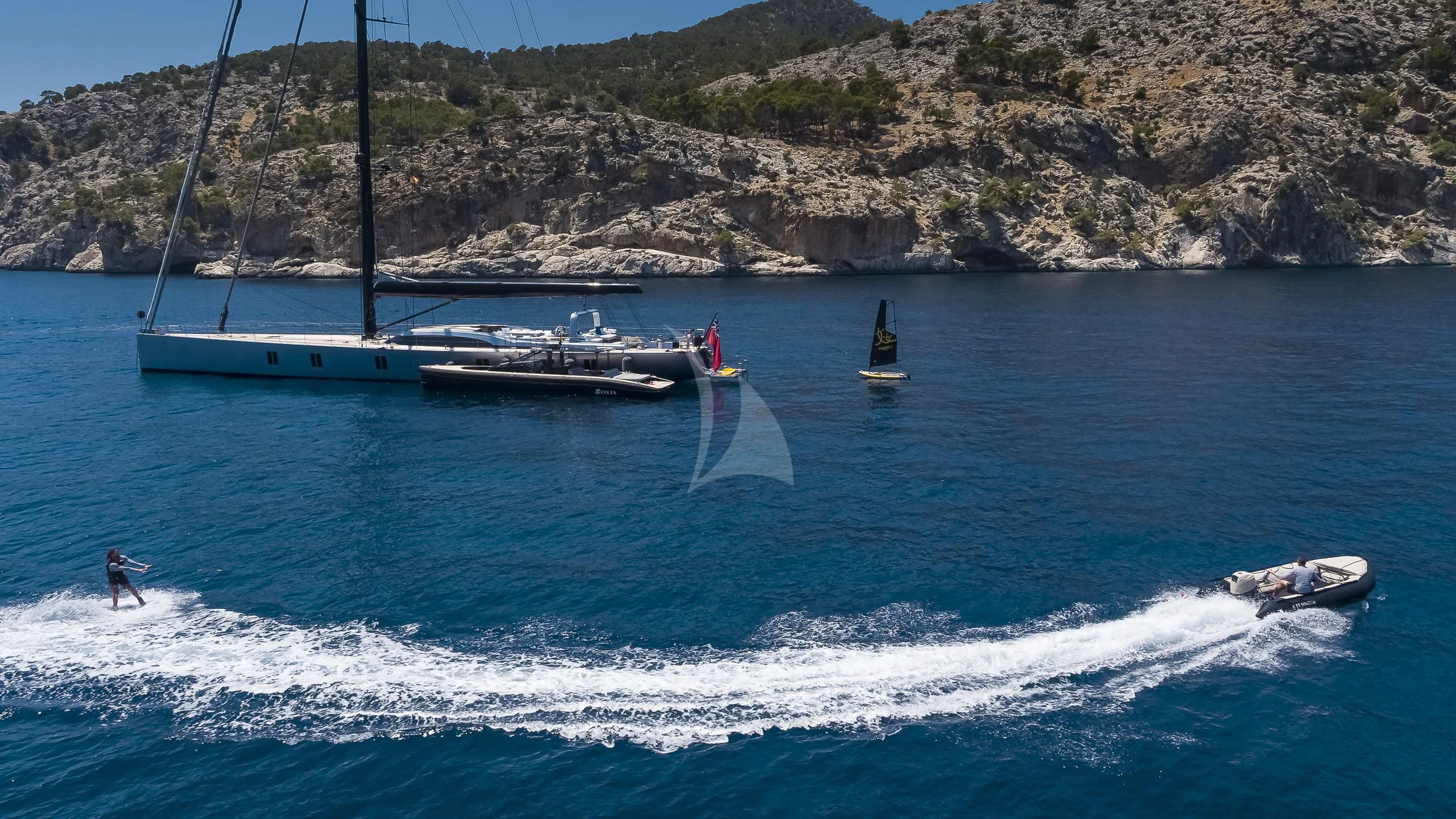 a person surfing on the sea aboard SHARLOU Yacht for Sale