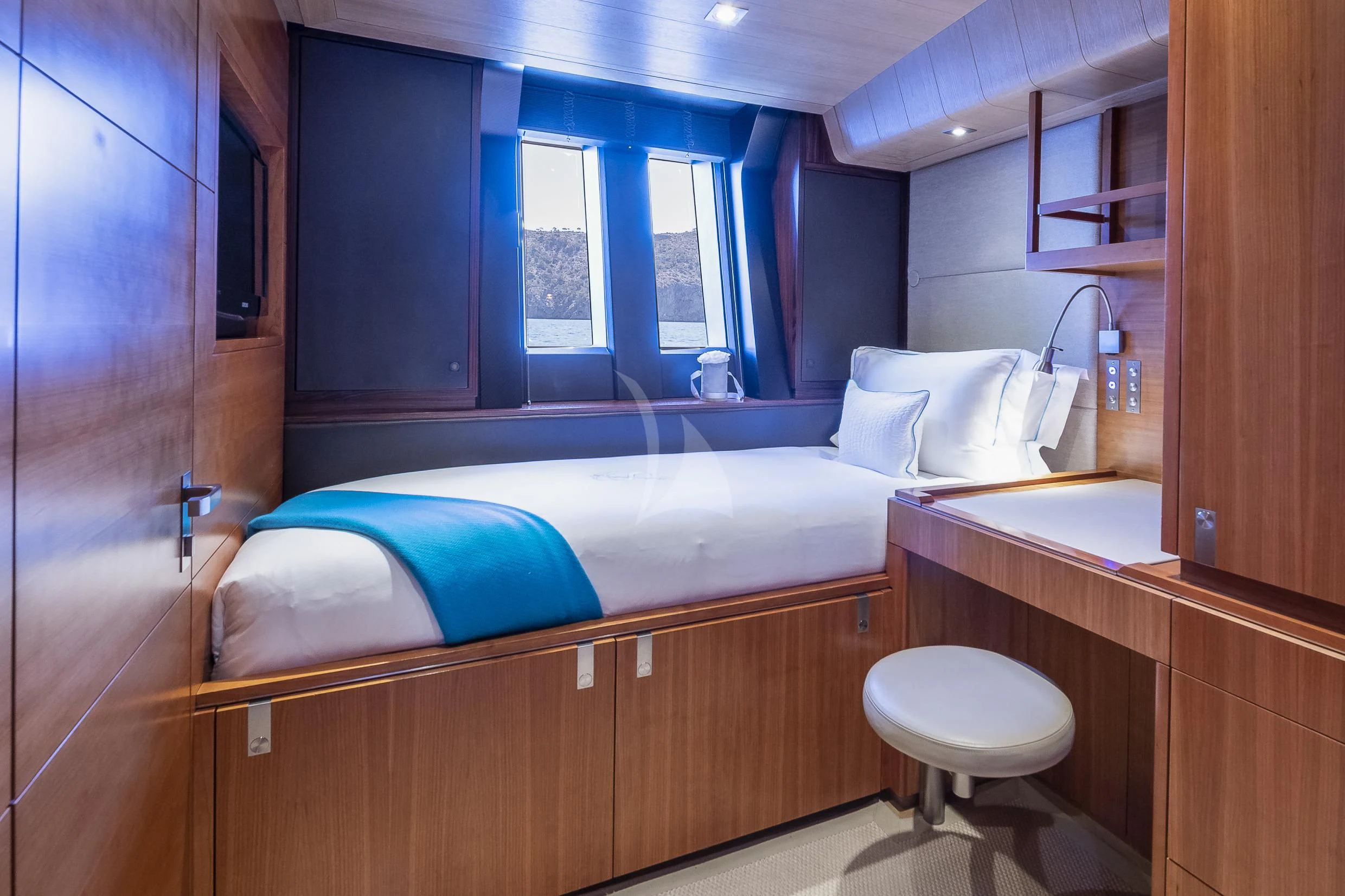 a bathroom with a bed and a sink aboard SHARLOU Yacht for Sale