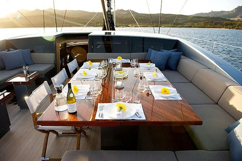 a table set for a dinner party aboard SHARLOU Yacht for Sale