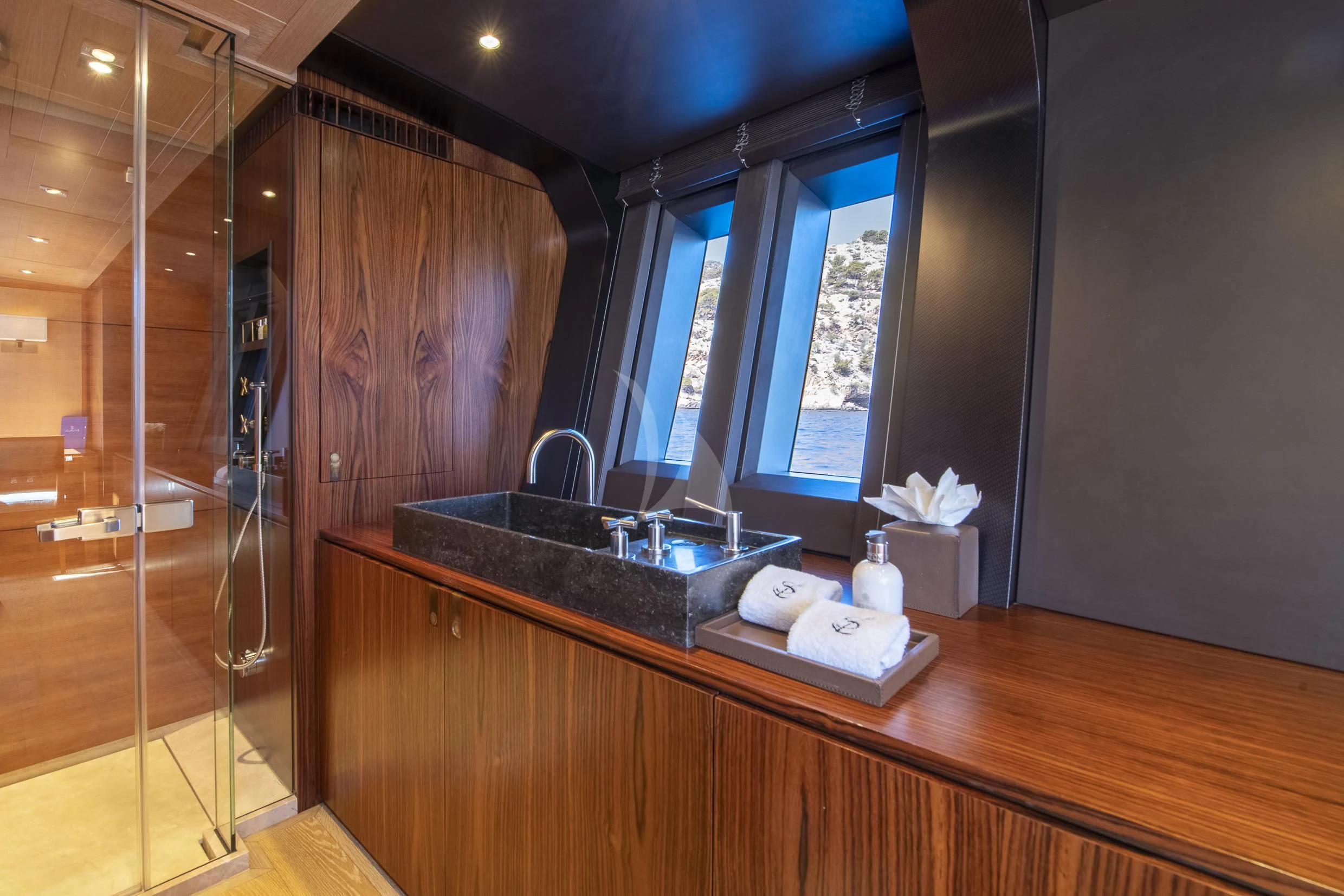 a bathroom with a glass shower aboard SHARLOU Yacht for Sale