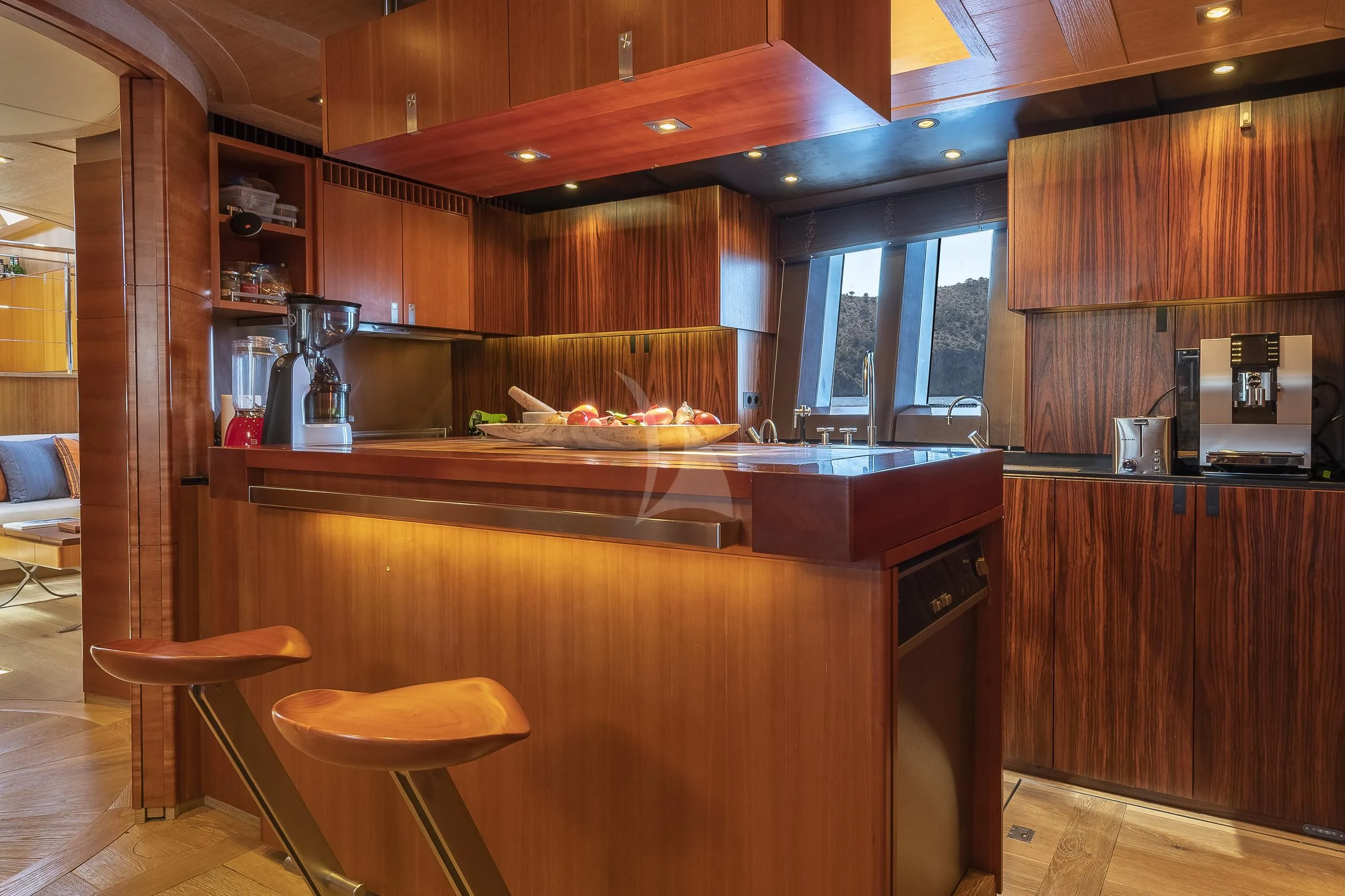 a kitchen with wooden cabinets aboard SHARLOU Yacht for Sale