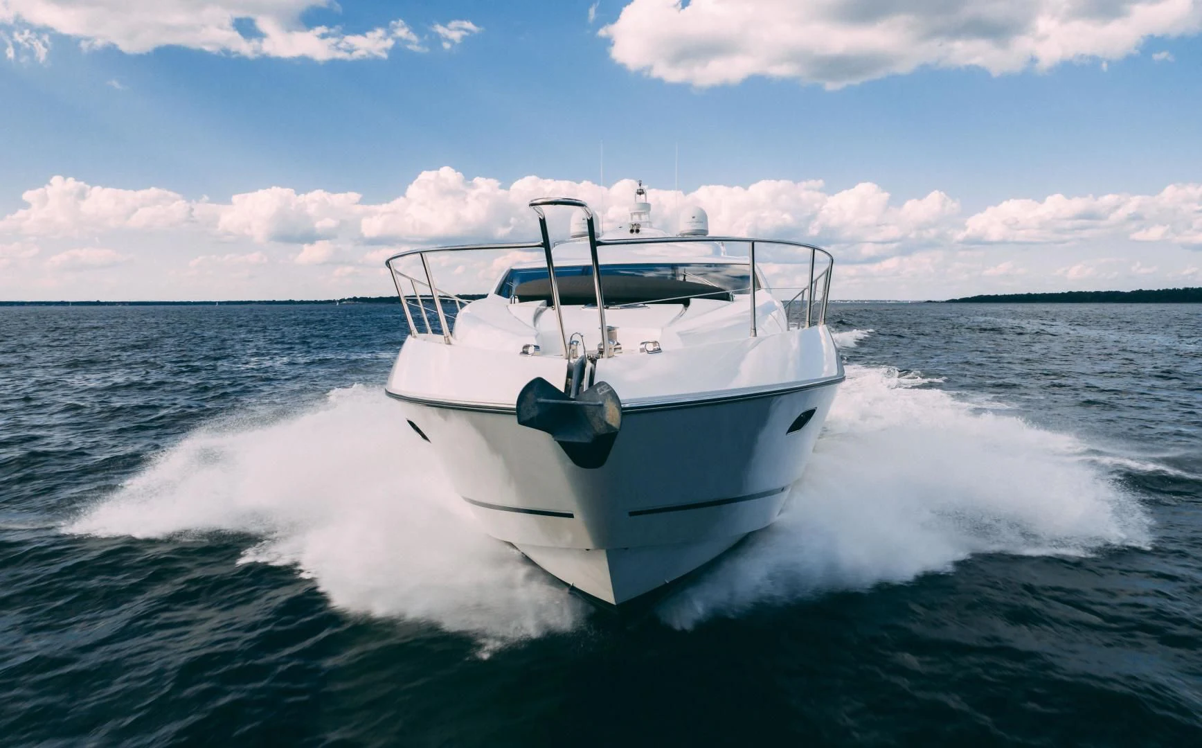 a white boat on the water aboard JIMBO Yacht for Sale