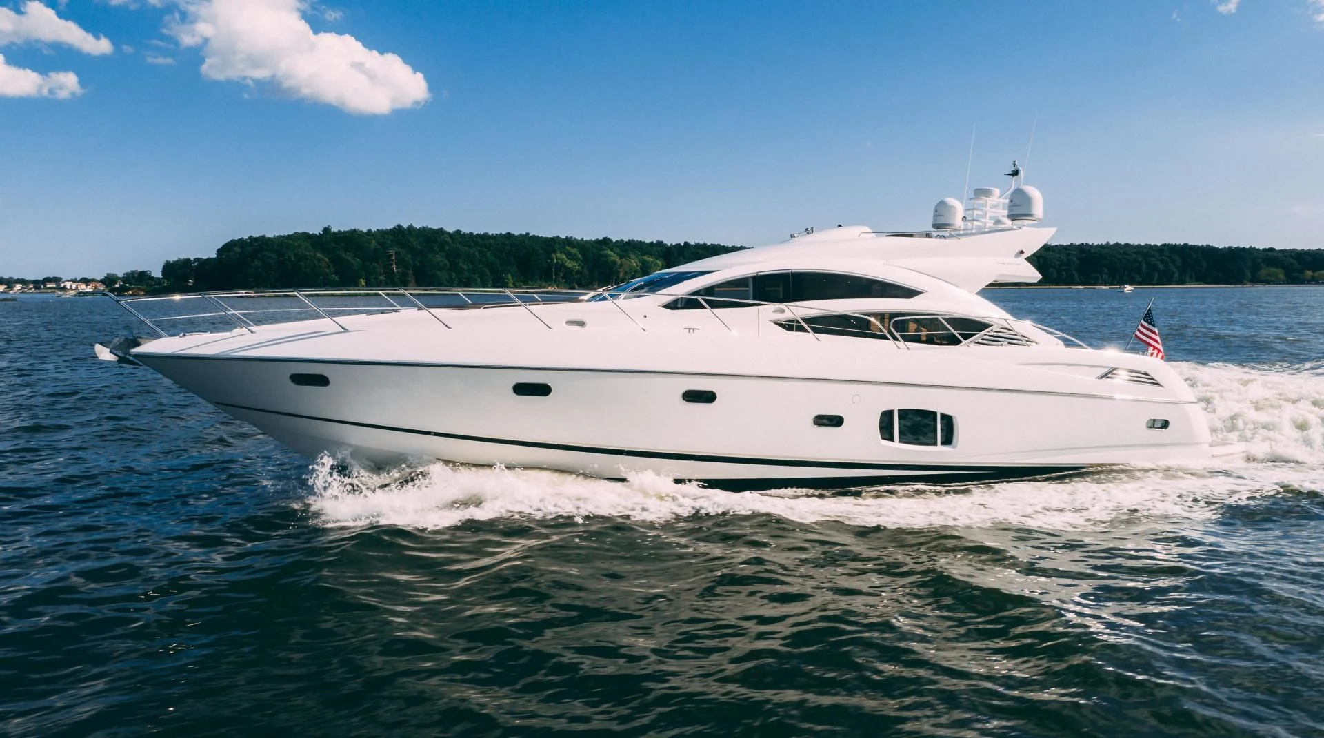 a white yacht on the water aboard JIMBO Yacht for Sale