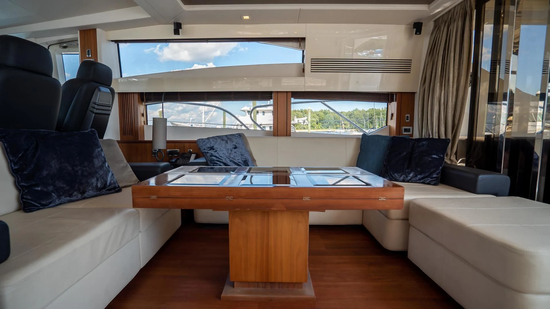 a room with a table and couch aboard JIMBO Yacht for Sale