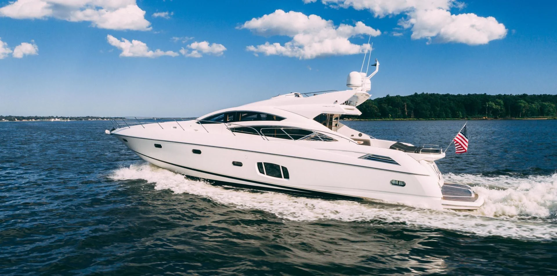 a white yacht on the water aboard JIMBO Yacht for Sale