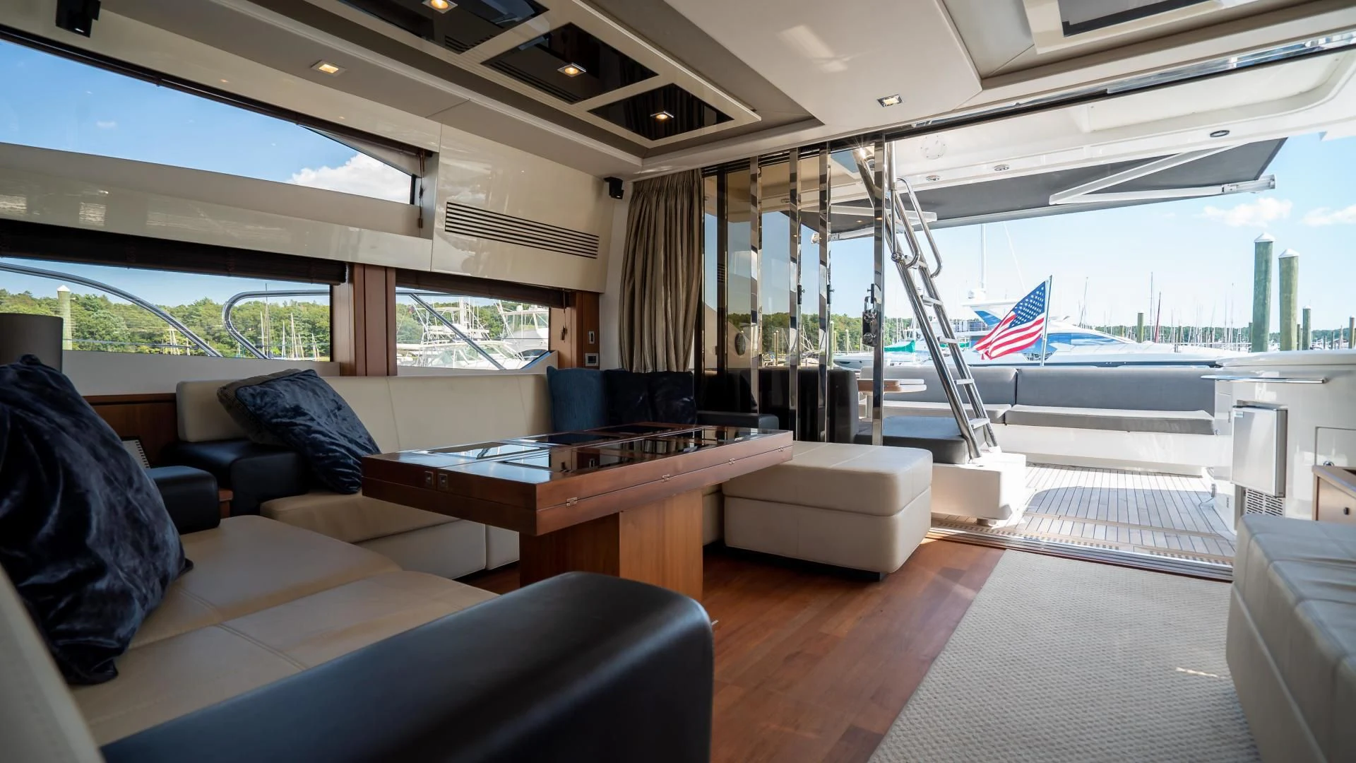 a room with a table and chairs aboard JIMBO Yacht for Sale
