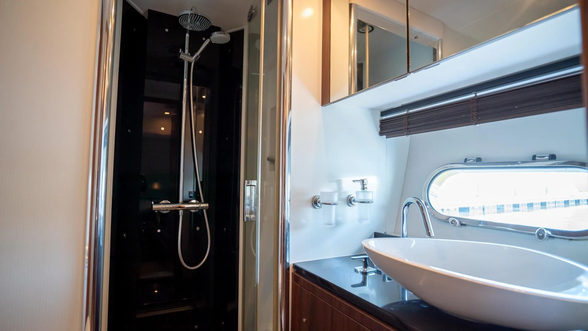 a bathroom with a sink and a mirror aboard JIMBO Yacht for Sale