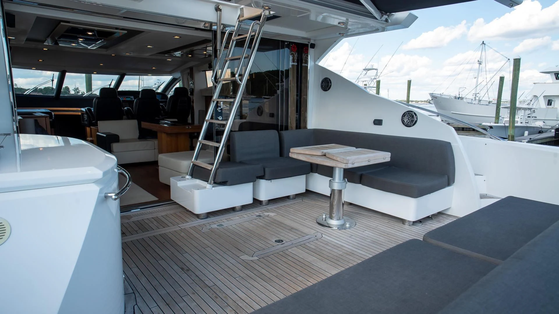 a boat with a table and chairs aboard JIMBO Yacht for Sale