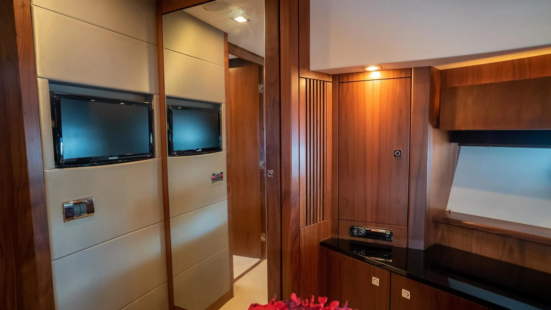a room with a tv and a cabinet aboard JIMBO Yacht for Sale