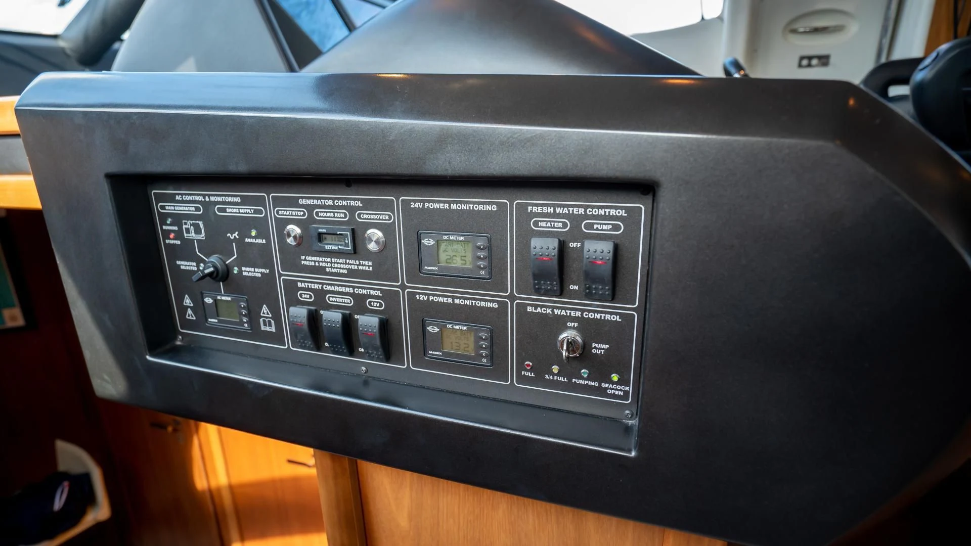 a black car with a screen aboard JIMBO Yacht for Sale