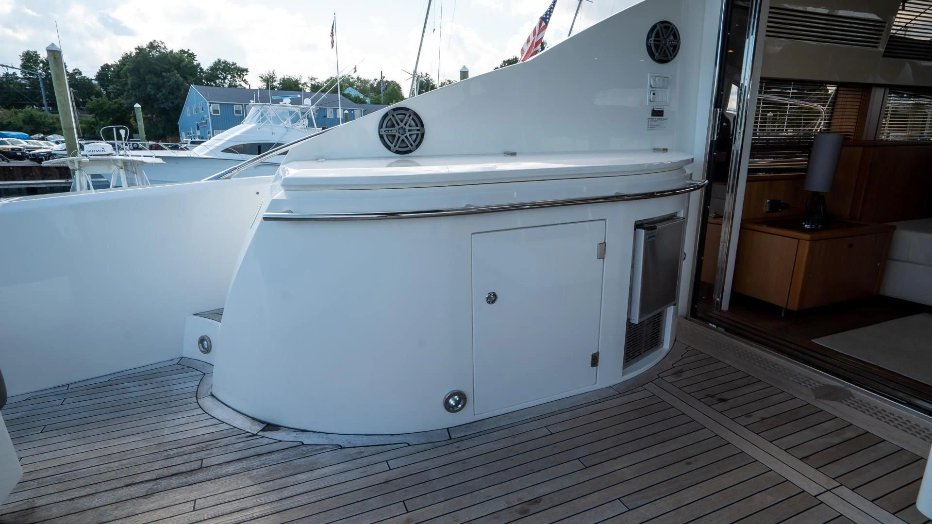 a white boat on a dock aboard JIMBO Yacht for Sale
