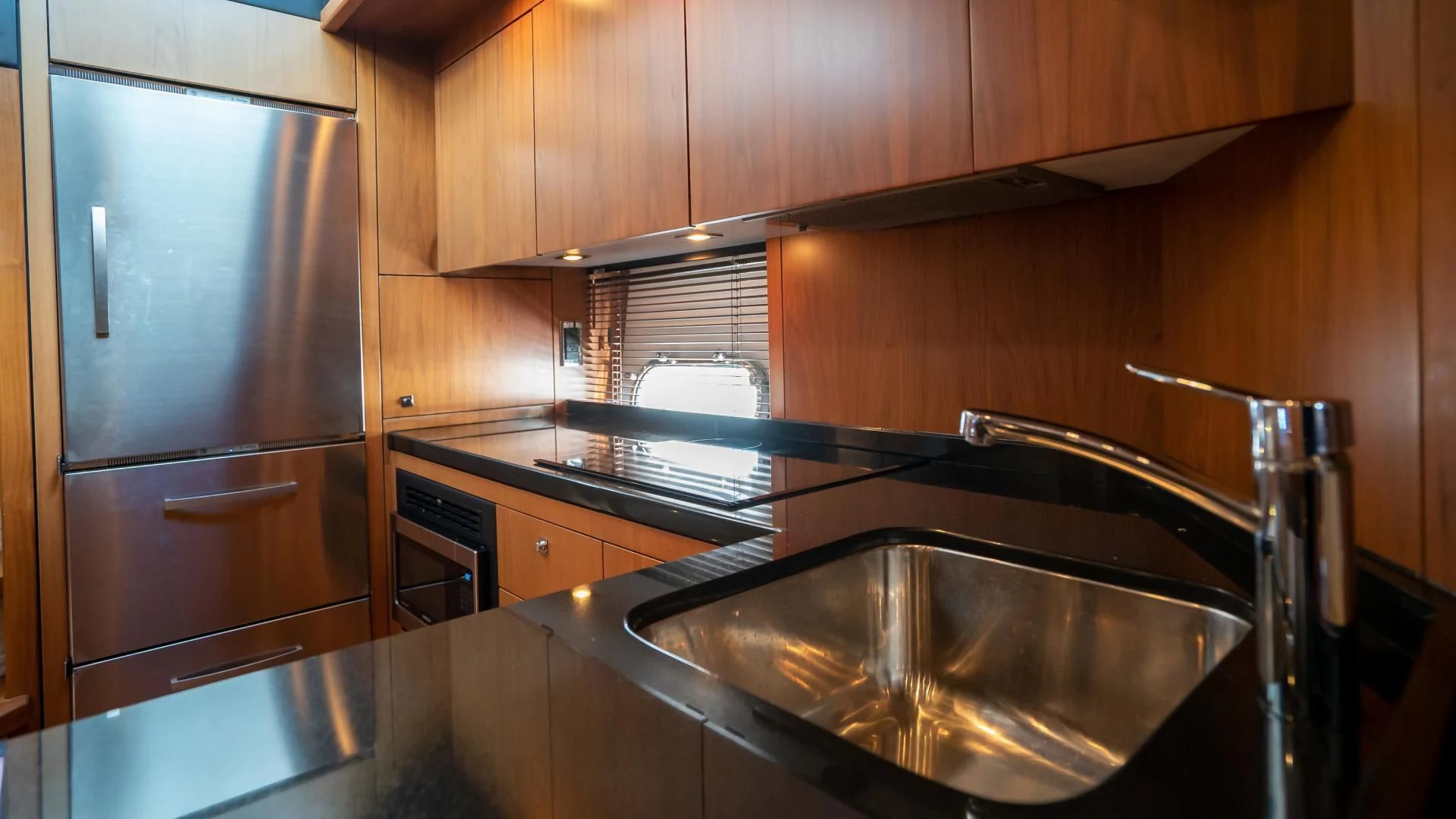 a kitchen with a stainless steel sink aboard JIMBO Yacht for Sale