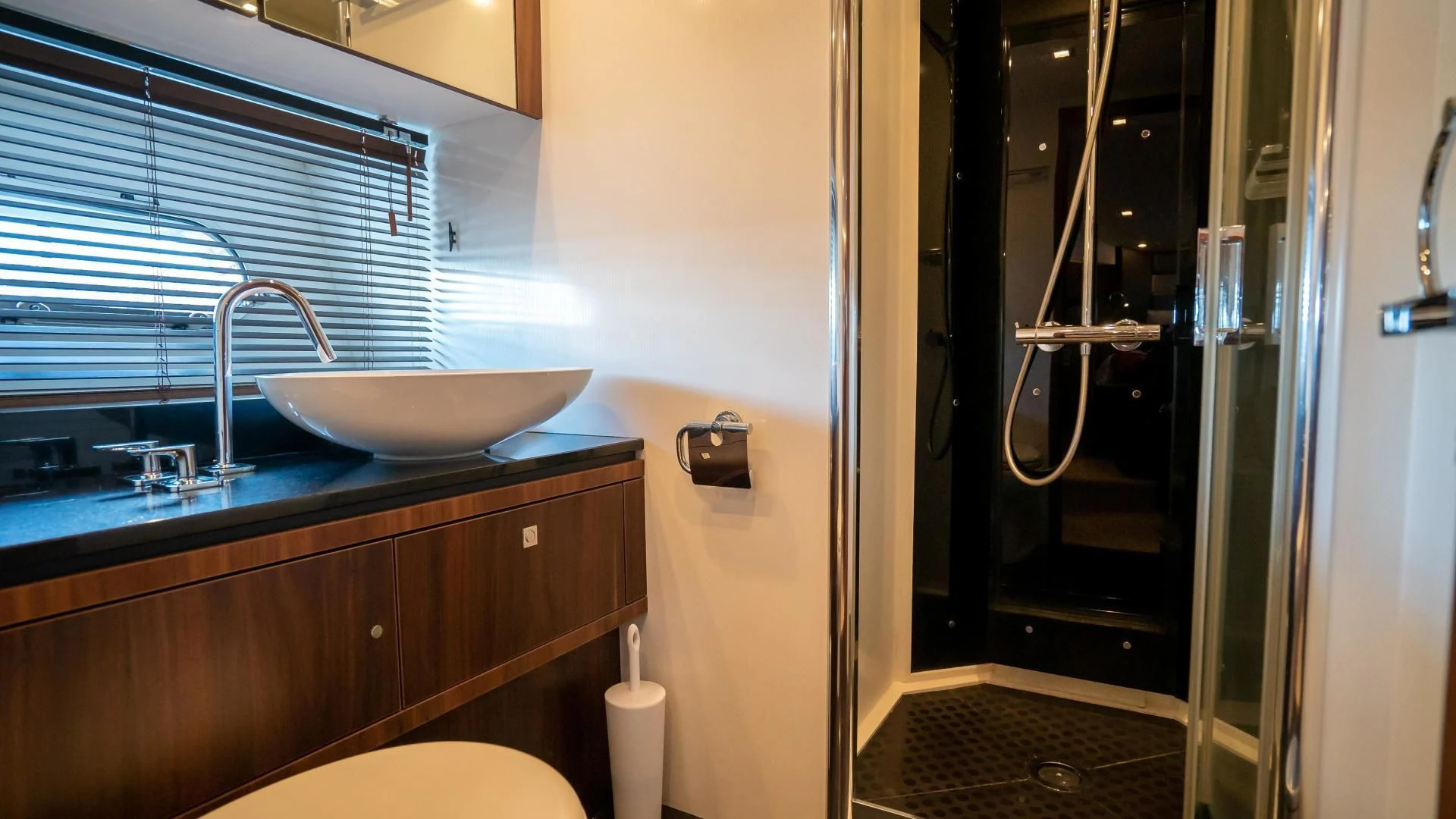 a bathroom with a sink and a mirror aboard JIMBO Yacht for Sale