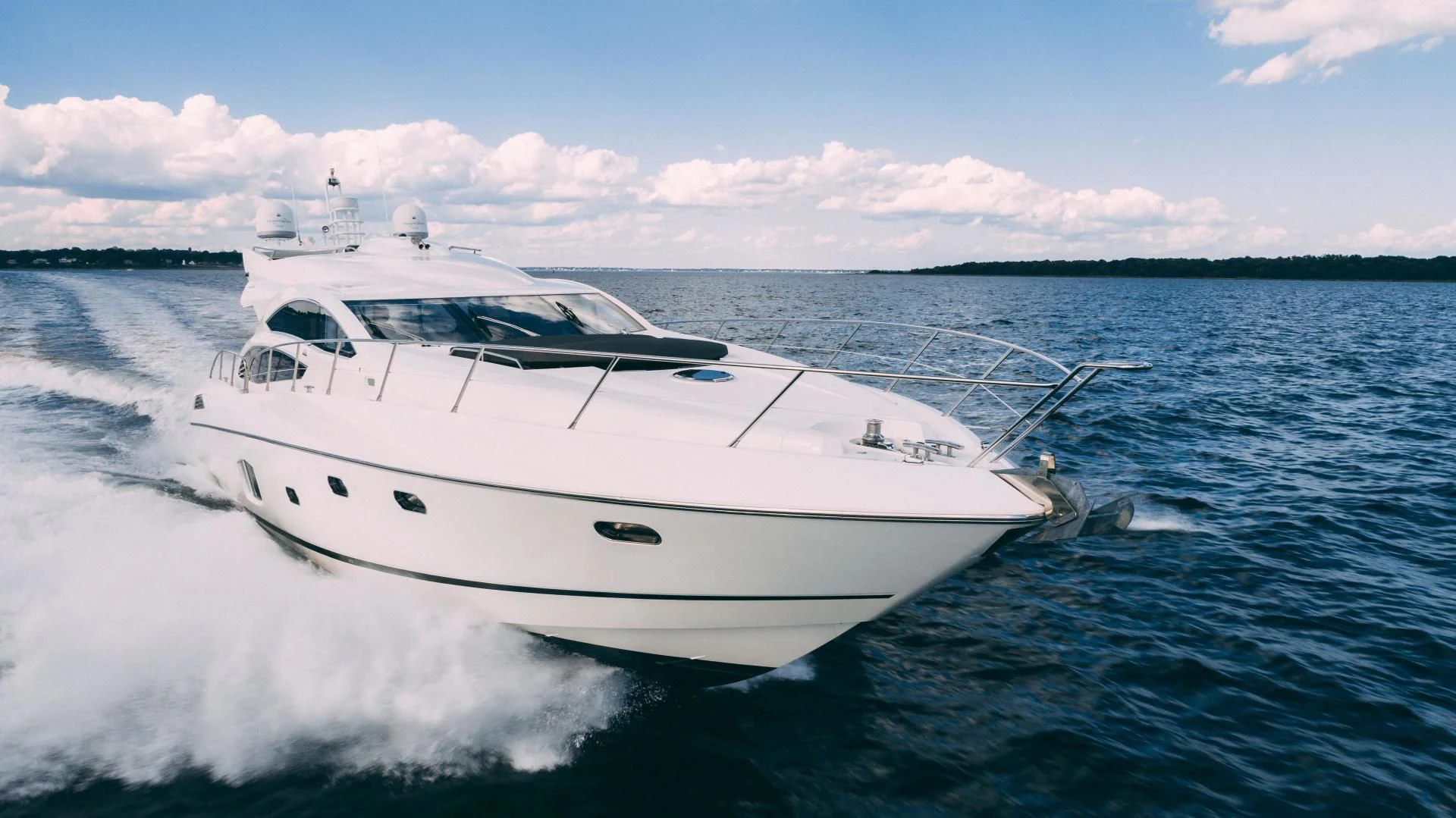 a white yacht on the water aboard JIMBO Yacht for Sale