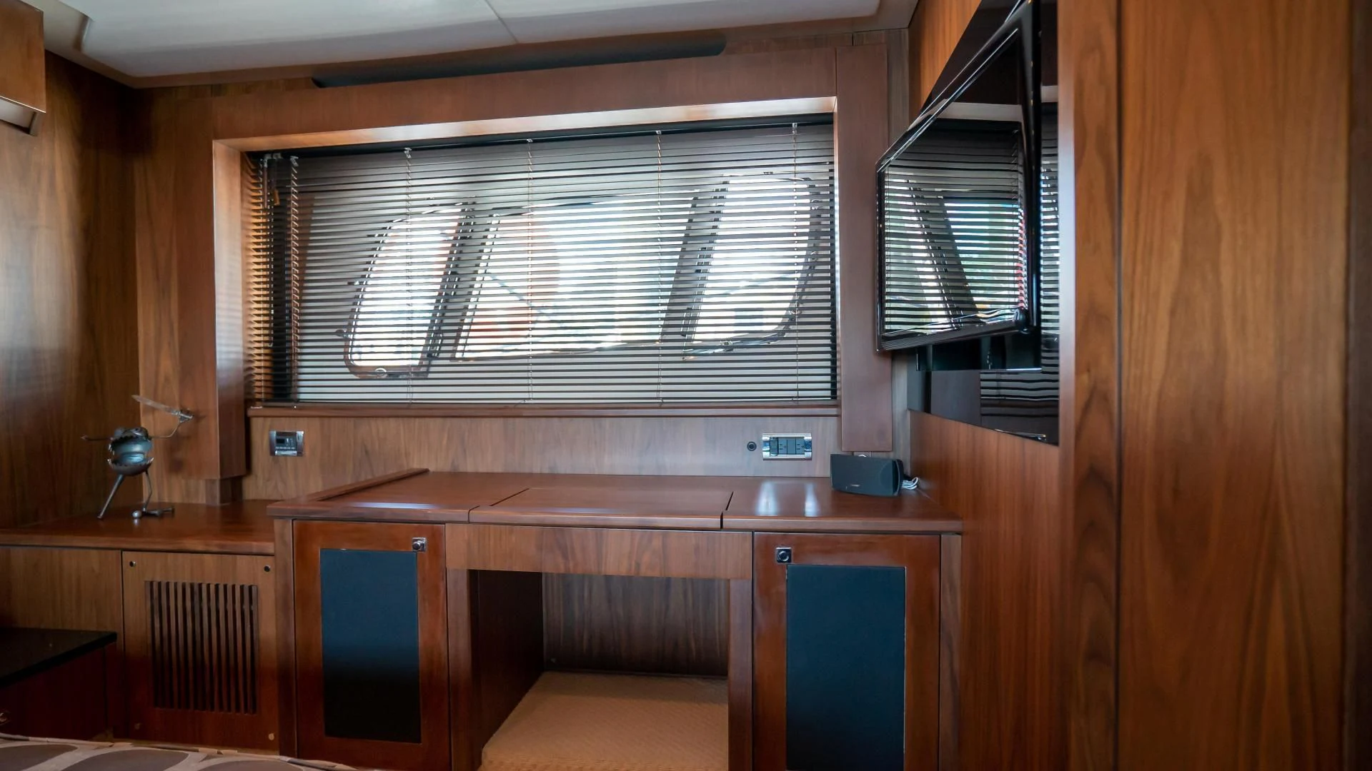 a room with a desk and cabinets aboard JIMBO Yacht for Sale