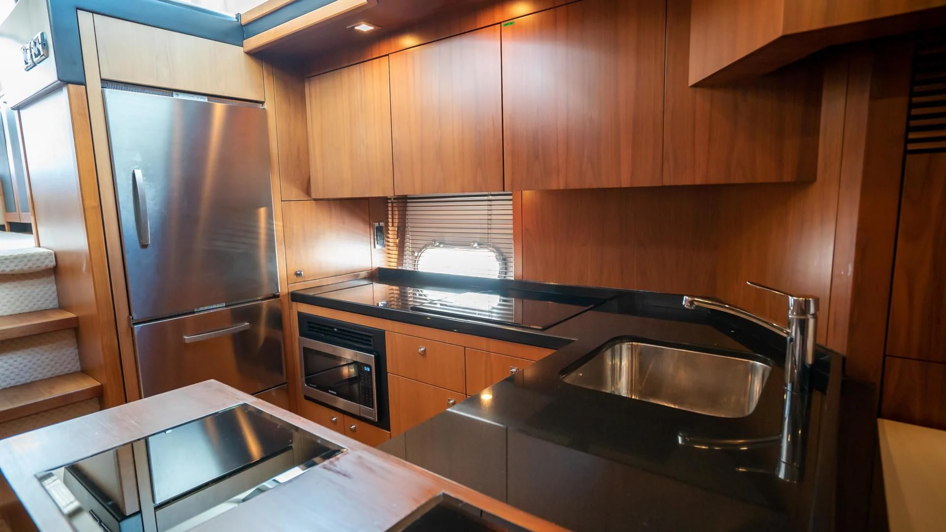 a kitchen with stainless steel appliances aboard JIMBO Yacht for Sale