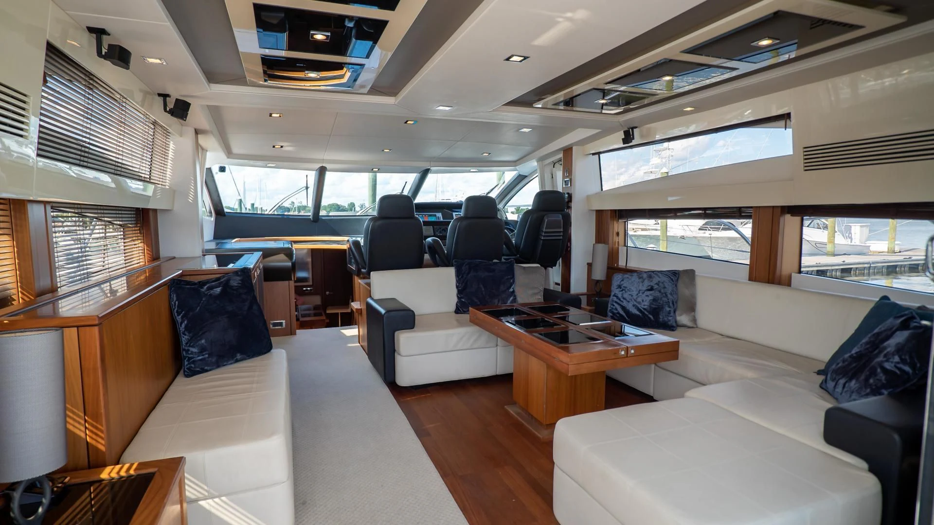 inside of a vehicle with a table and chairs aboard JIMBO Yacht for Sale
