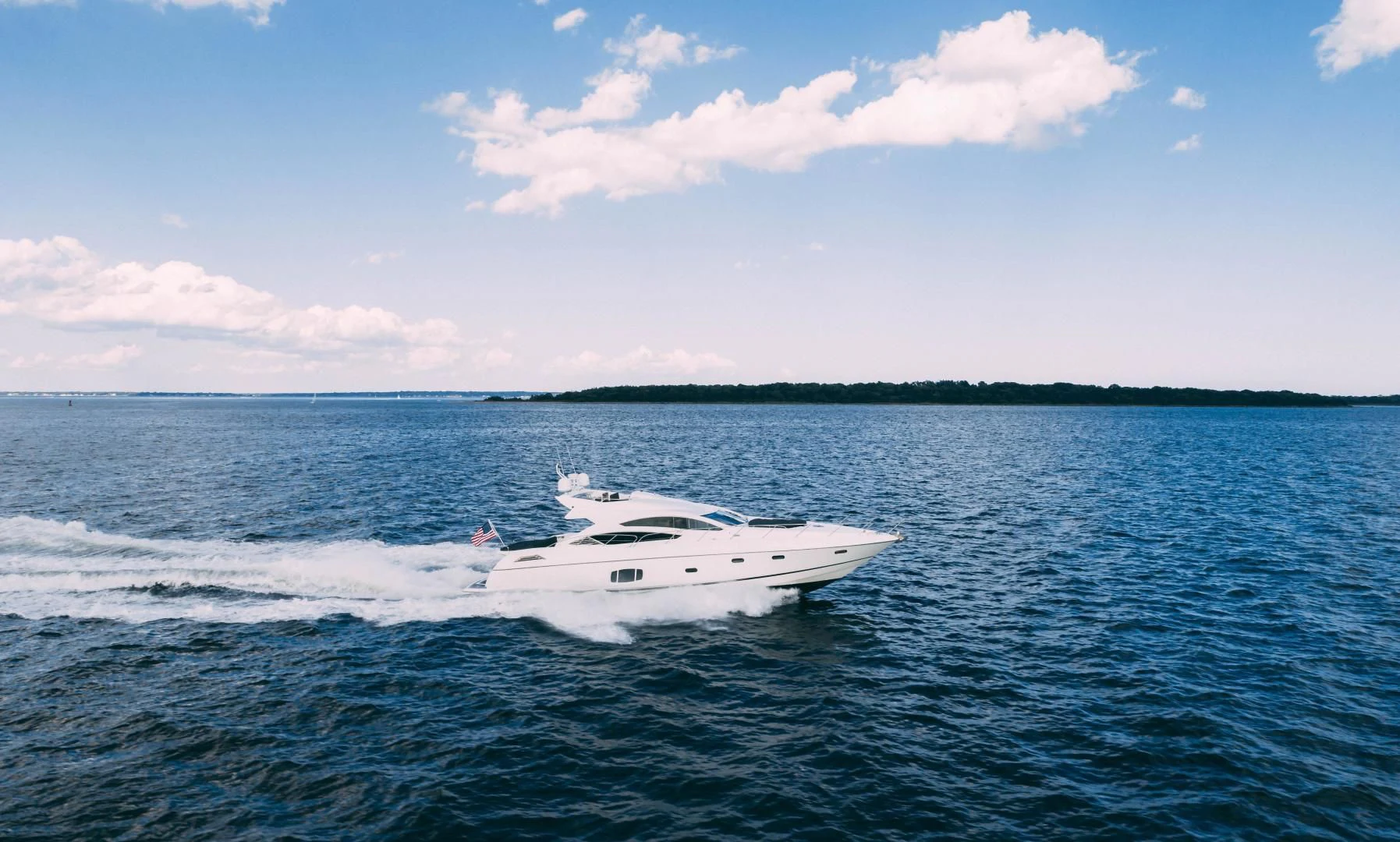 a white boat in the water aboard JIMBO Yacht for Sale