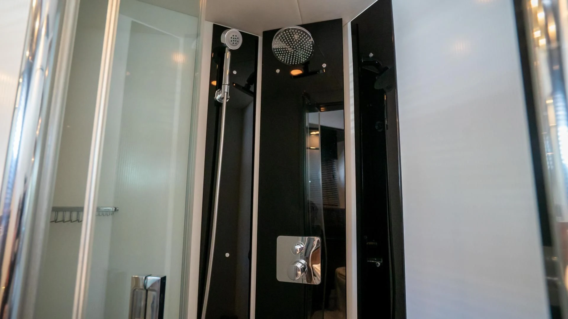 a room with a mirror and a light aboard JIMBO Yacht for Sale