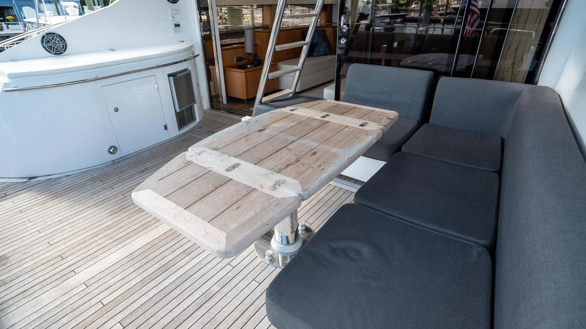 a couch and a coffee table aboard JIMBO Yacht for Sale