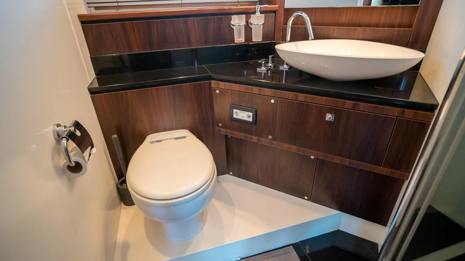 a bathroom with a toilet and sink aboard JIMBO Yacht for Sale