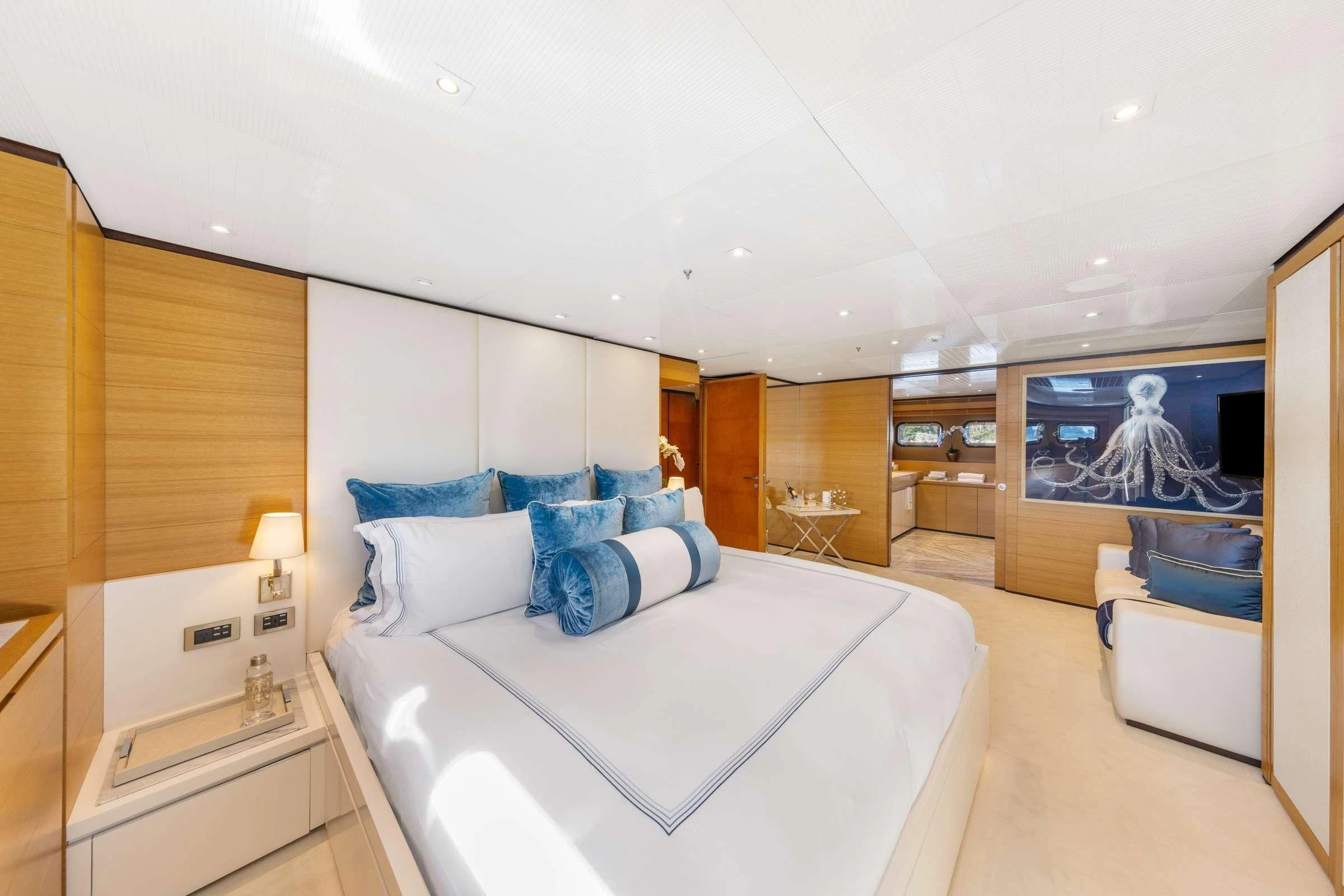 a large bedroom with a bed aboard MISCHIEF Yacht for Sale