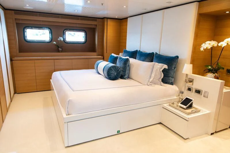 a white couch in a room aboard MISCHIEF Yacht for Sale