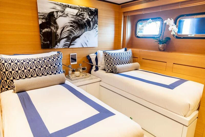 a room with beds and a tv aboard MISCHIEF Yacht for Sale