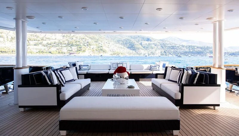 a room with couches and a table aboard MISCHIEF Yacht for Sale