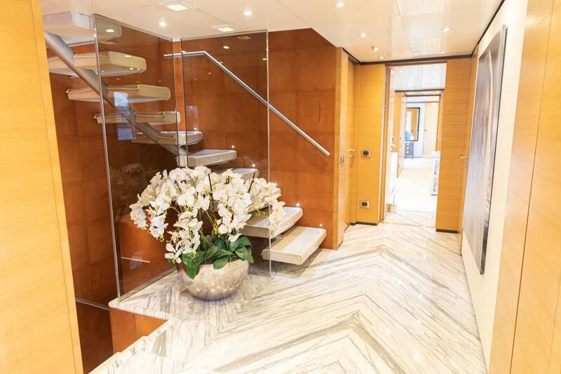 a vase of flowers on a table aboard MISCHIEF Yacht for Sale