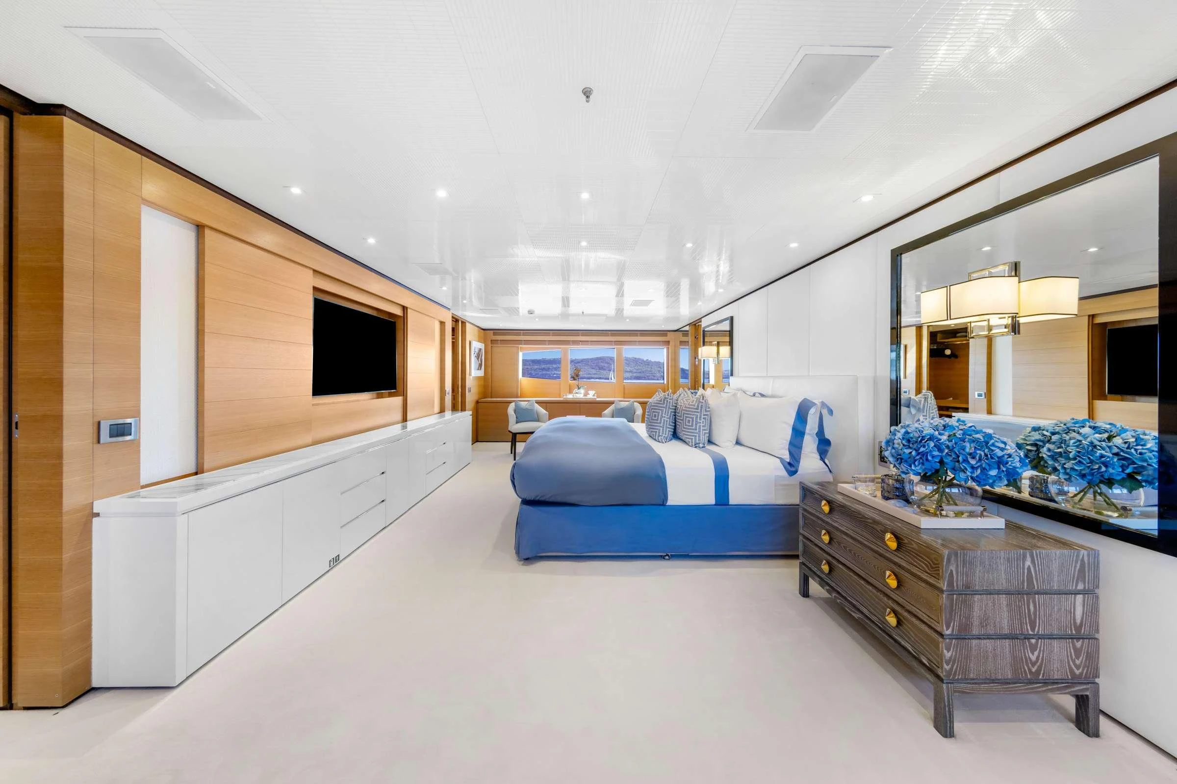a large room with a bed and desk aboard MISCHIEF Yacht for Sale
