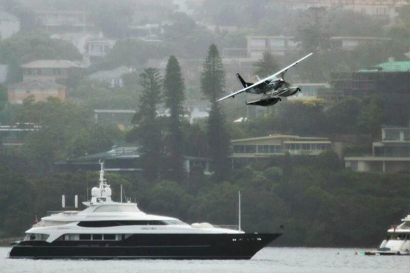 a helicopter flying over a boat aboard MISCHIEF Yacht for Sale