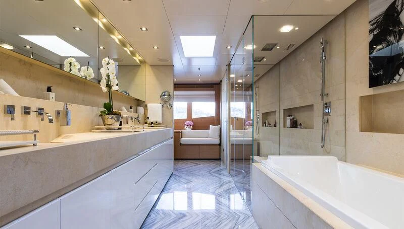 a large bathroom with a tub and a sink aboard MISCHIEF Yacht for Sale