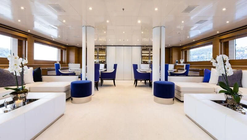 a room with white furniture aboard MISCHIEF Yacht for Sale