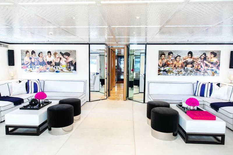 a room with a couch and a tv aboard MISCHIEF Yacht for Sale