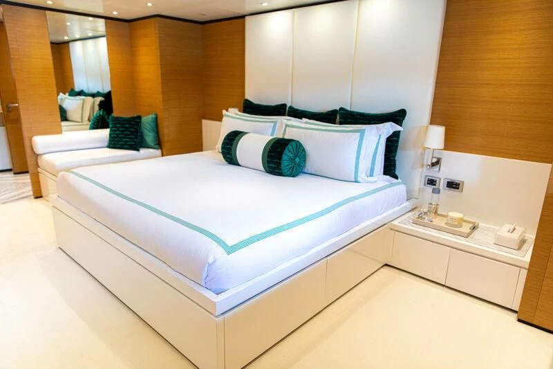 a bed with white sheets aboard MISCHIEF Yacht for Sale