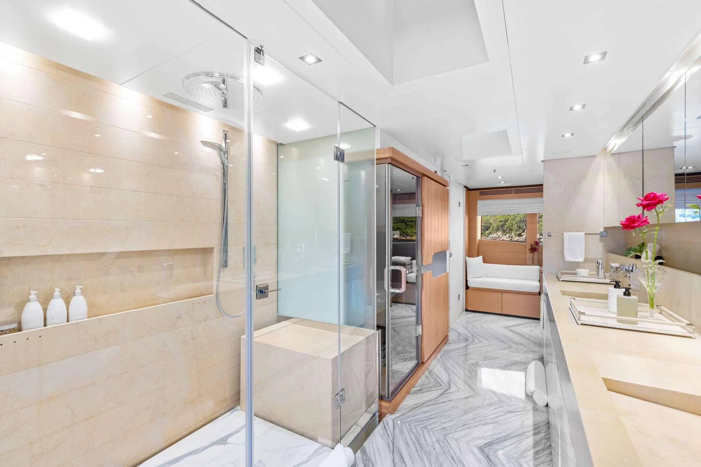 a modern bathroom with a glass shower aboard MISCHIEF Yacht for Sale