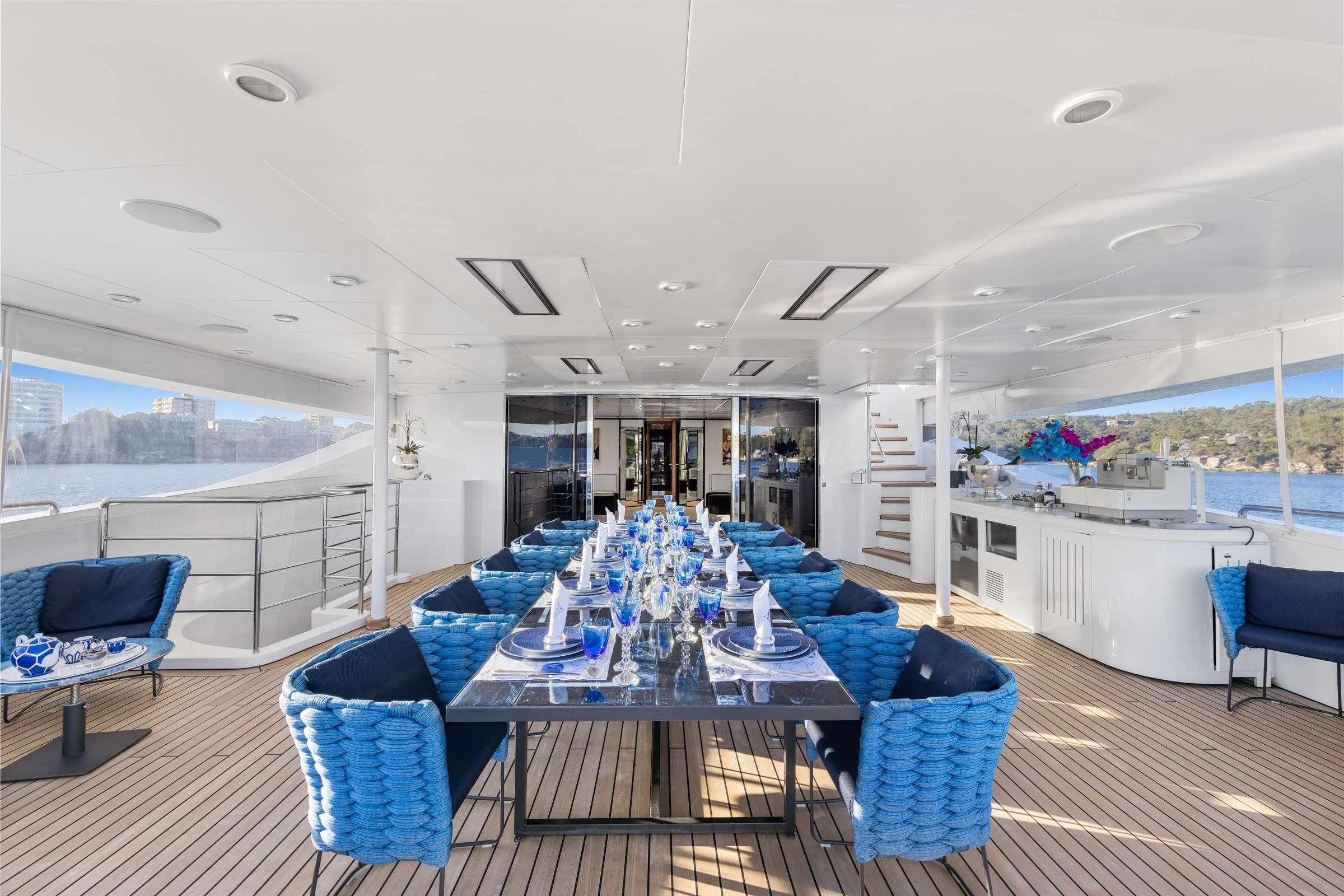 a large room with a table and chairs aboard MISCHIEF Yacht for Sale