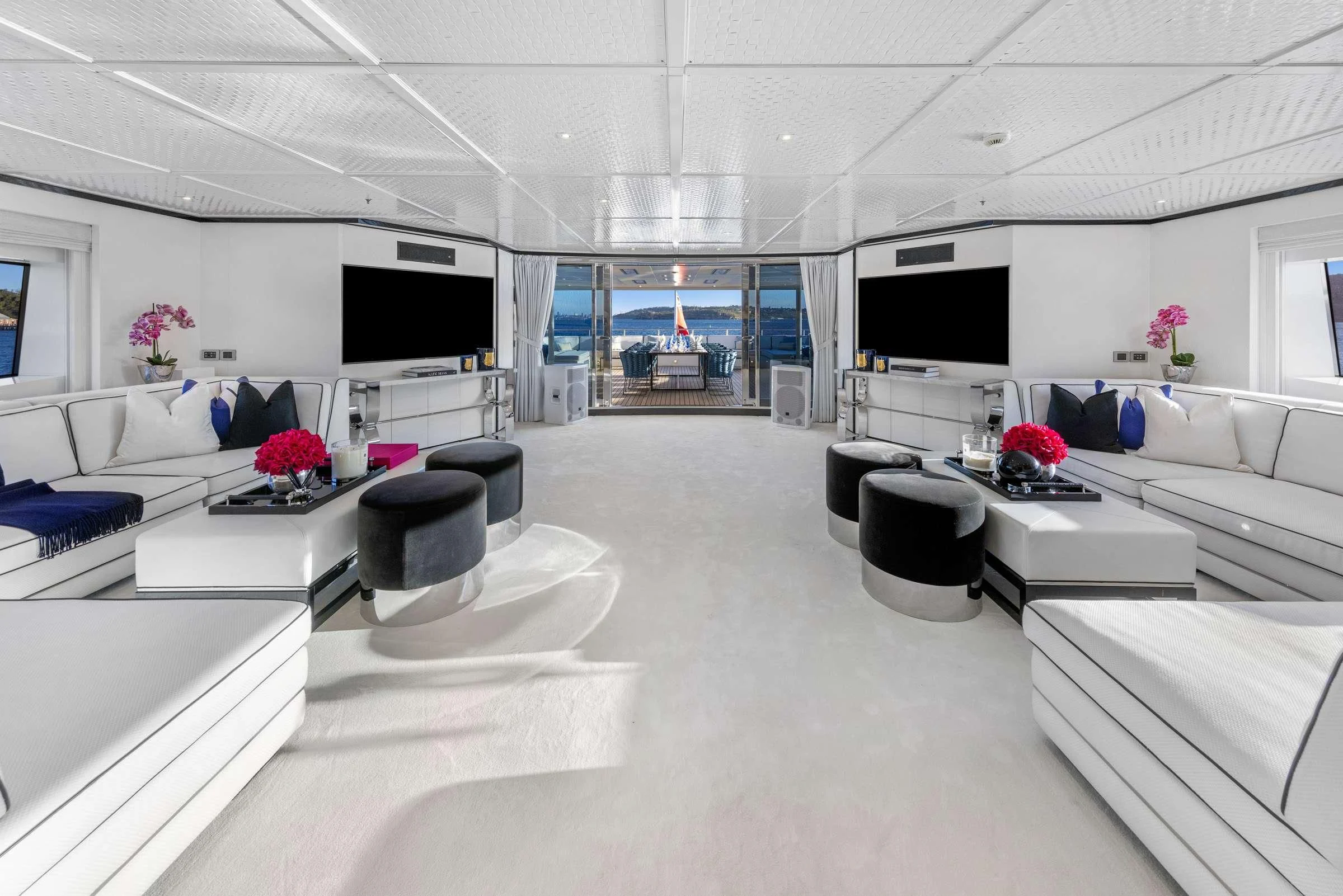 a room with white furniture aboard MISCHIEF Yacht for Sale