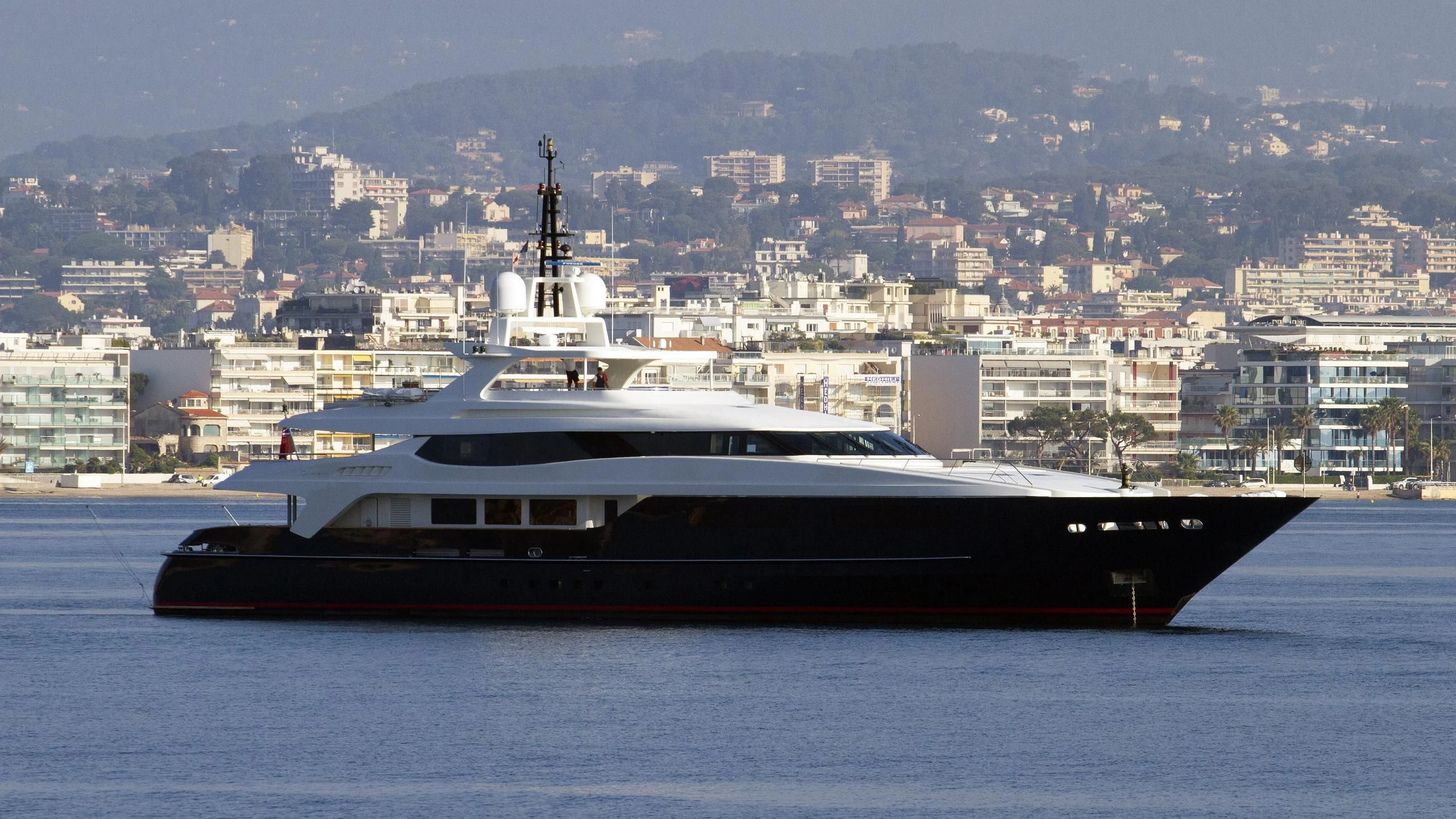 a large ship in the water aboard MISCHIEF Yacht for Sale