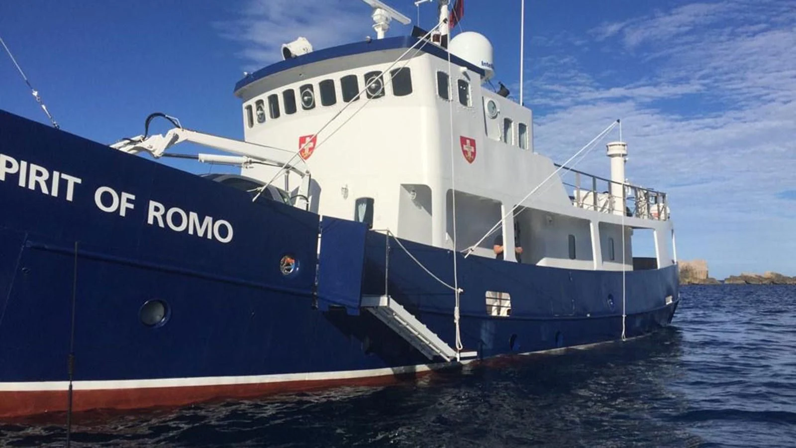 a large blue and white boat aboard SPIRIT OF GINETTE Yacht for Sale