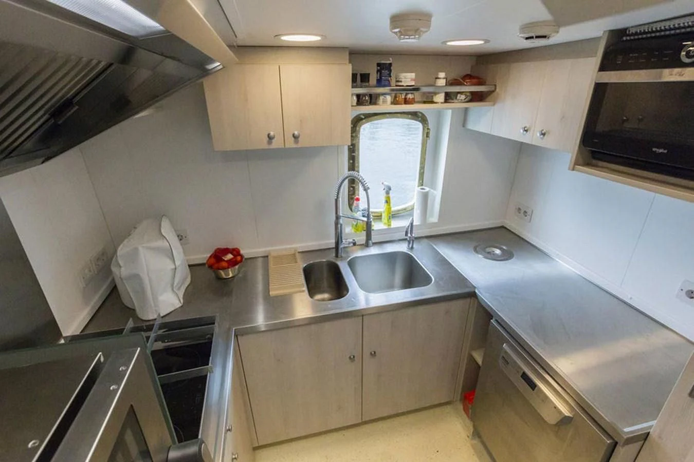 a kitchen with a sink and a microwave aboard SPIRIT OF GINETTE Yacht for Sale