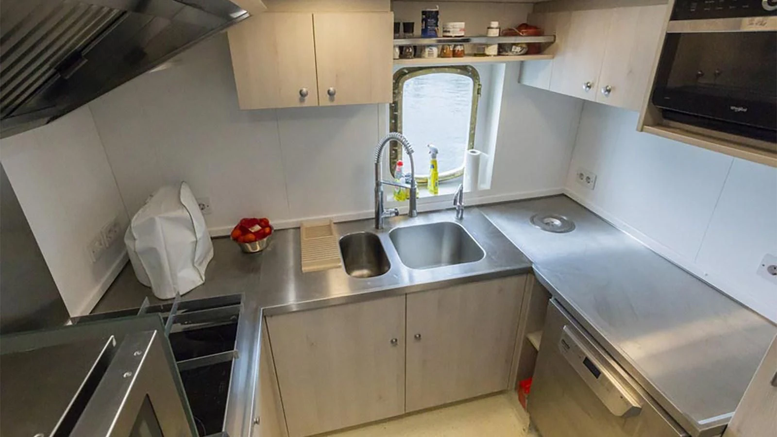 a kitchen with a sink and cabinets aboard SPIRIT OF GINETTE Yacht for Sale