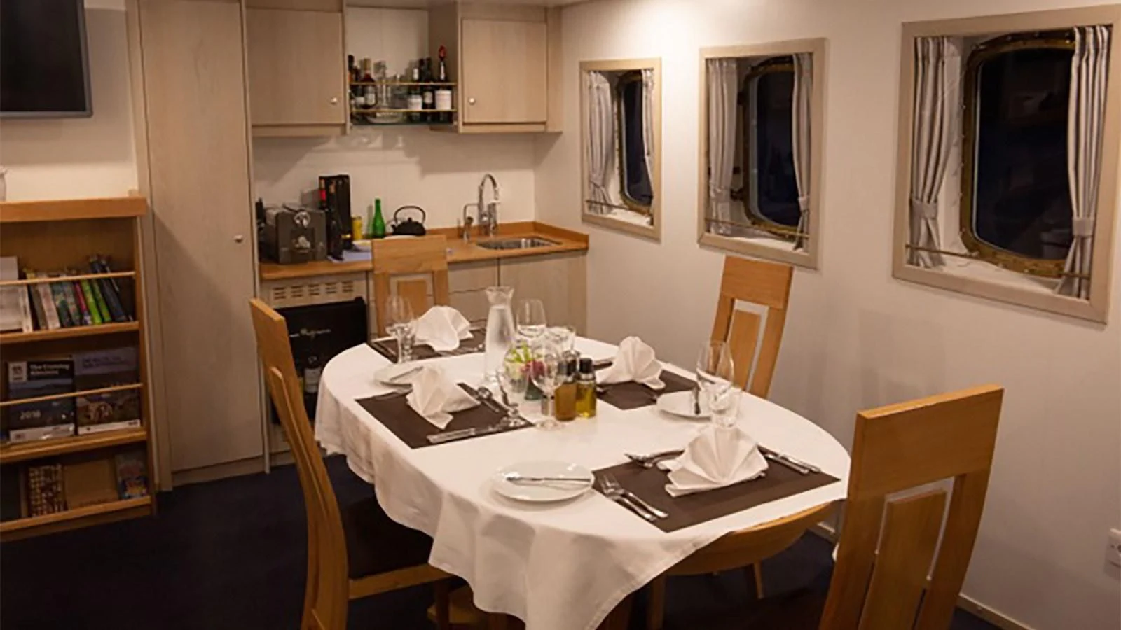 a dining table in a kitchen aboard SPIRIT OF GINETTE Yacht for Sale