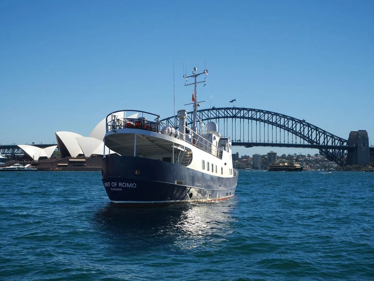 a boat sailing under a bridge aboard SPIRIT OF GINETTE Yacht for Sale