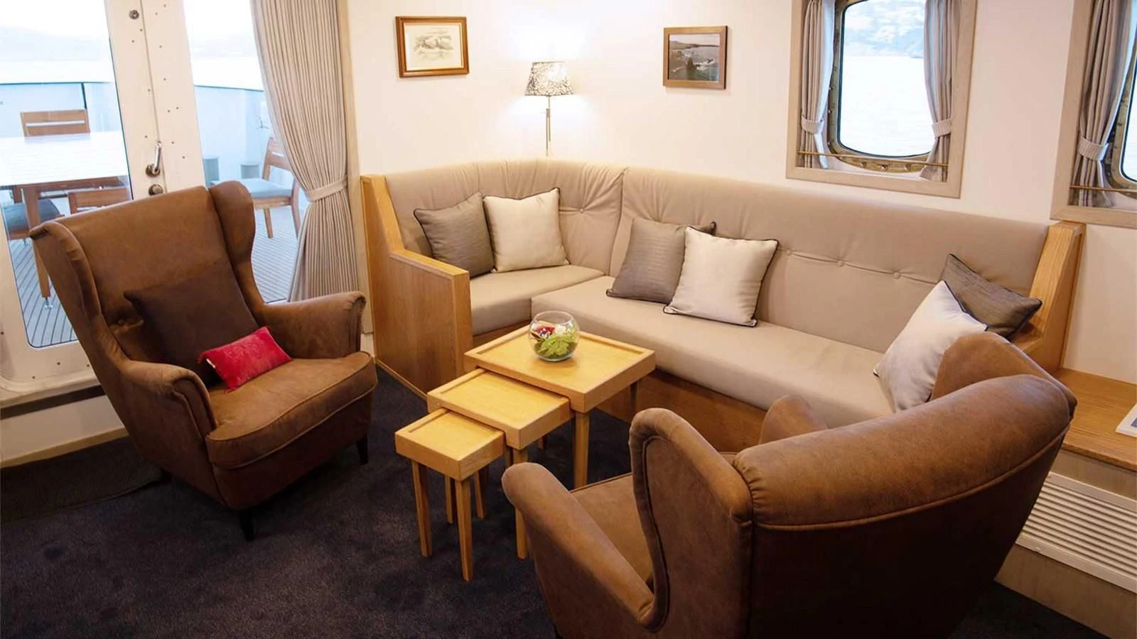 a living room with couches and a table aboard SPIRIT OF GINETTE Yacht for Sale